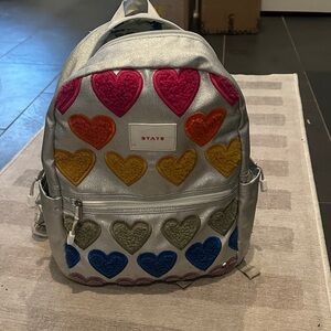 STATE Silver Backpack with Multicolor Heart Accents. Excellent condition.